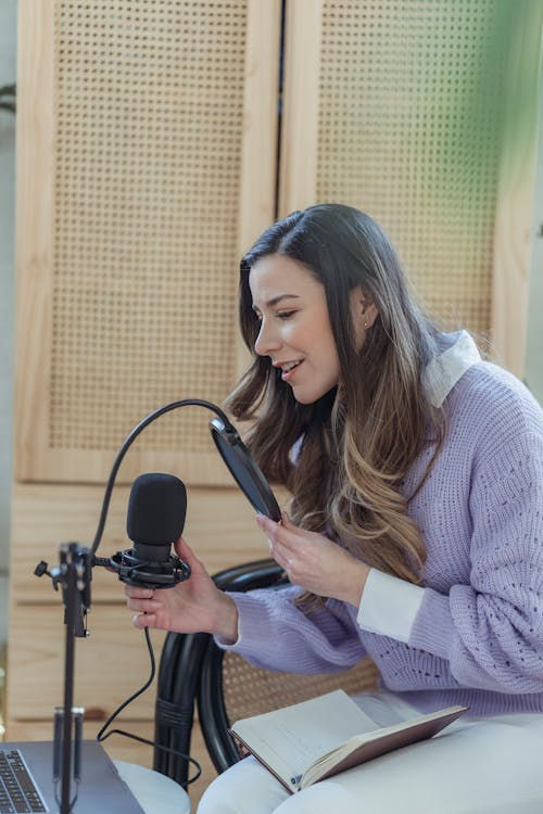 a woman in a purple sweater.