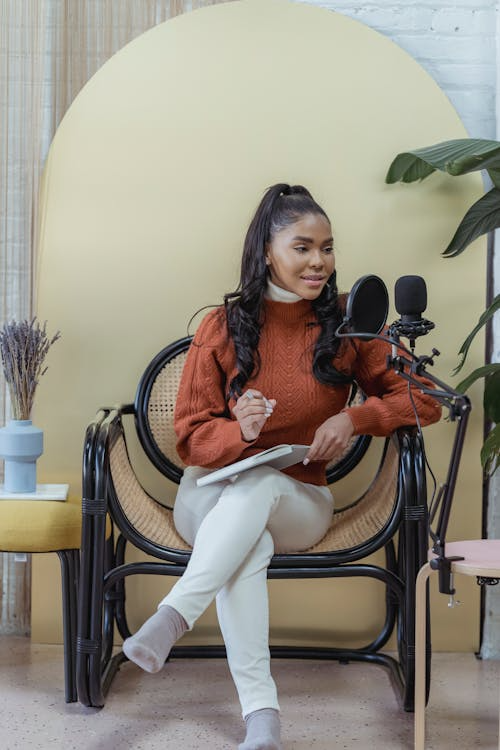 a woman speaking into a mic.