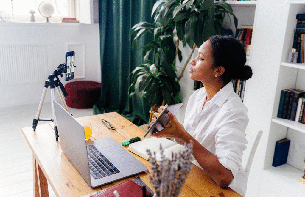a woman in a white shirt creating content.