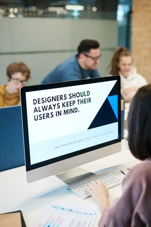 Computer screen displaying the phrase “Designers should always keep their users in mind.”