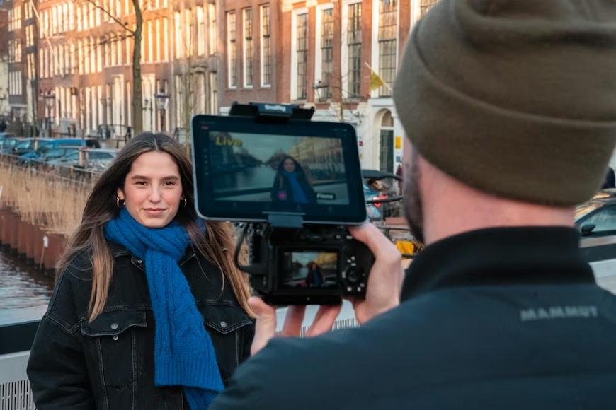 A person recording another person using a camera