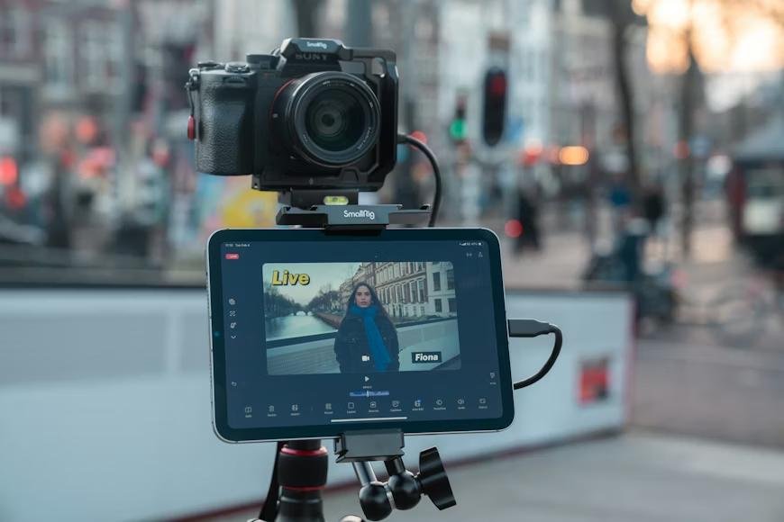 A camera and tablet attached to a tripod