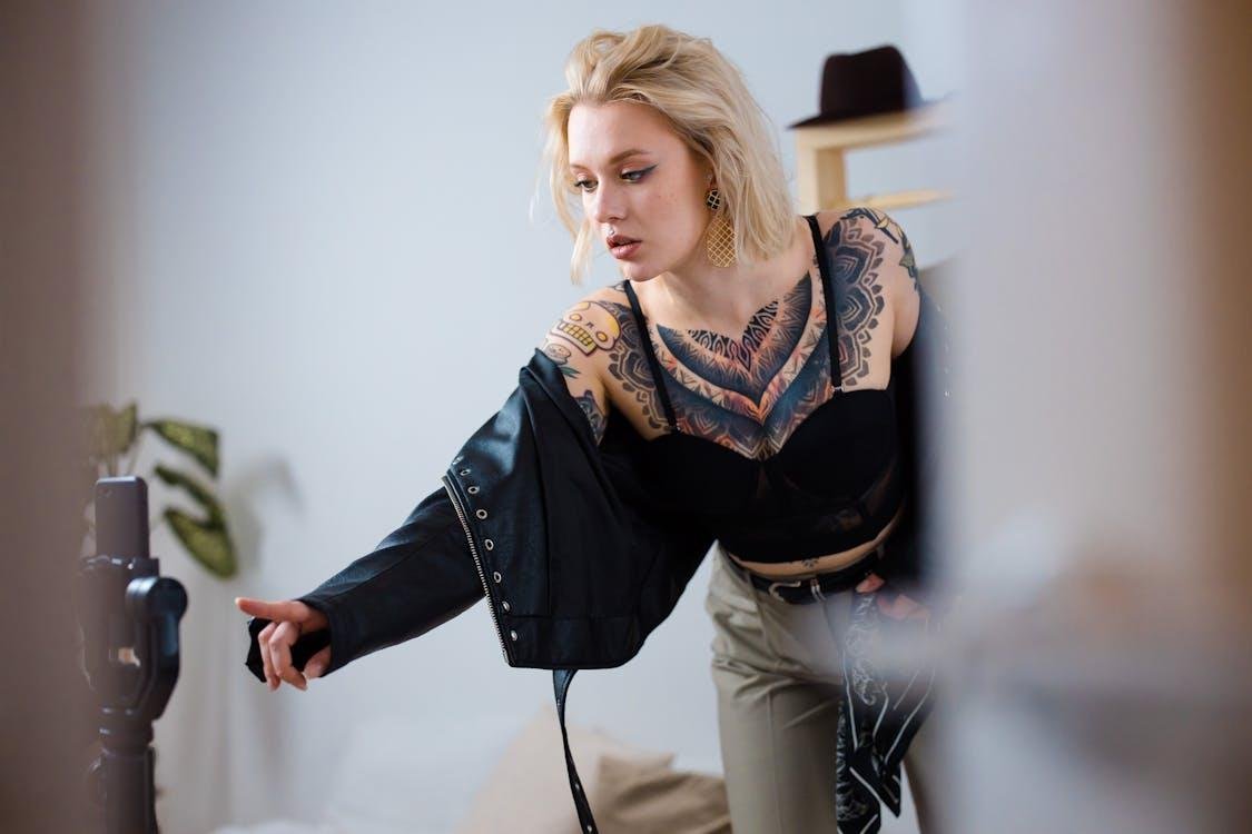 A person posing in front of a smartphone